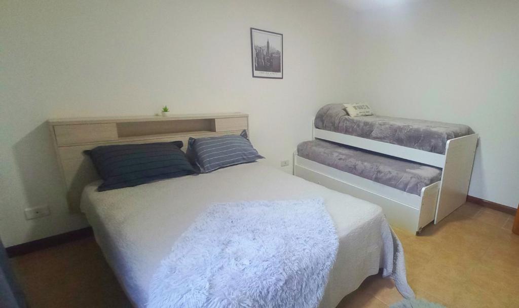 Postel nebo postele na pokoji v ubytování Espectacular departamento con vista panoramica a las montañas y canal zona centrica