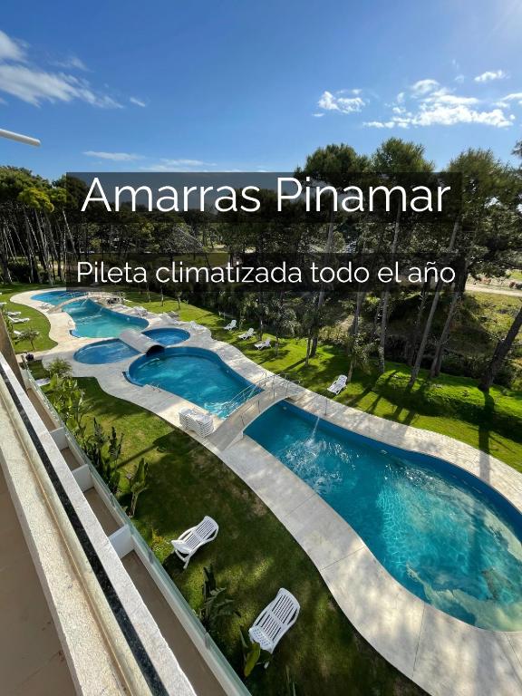 a swimming pool at an americas pismaismaismaidaongaongaonga at at Departamento 3 ambientes - Amarras Pinamar in Pinamar