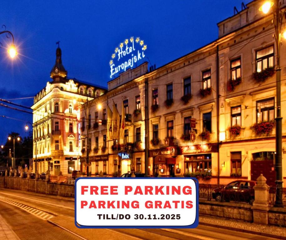 a free parking sign in front of a building at Hotel Europejski in Kraków