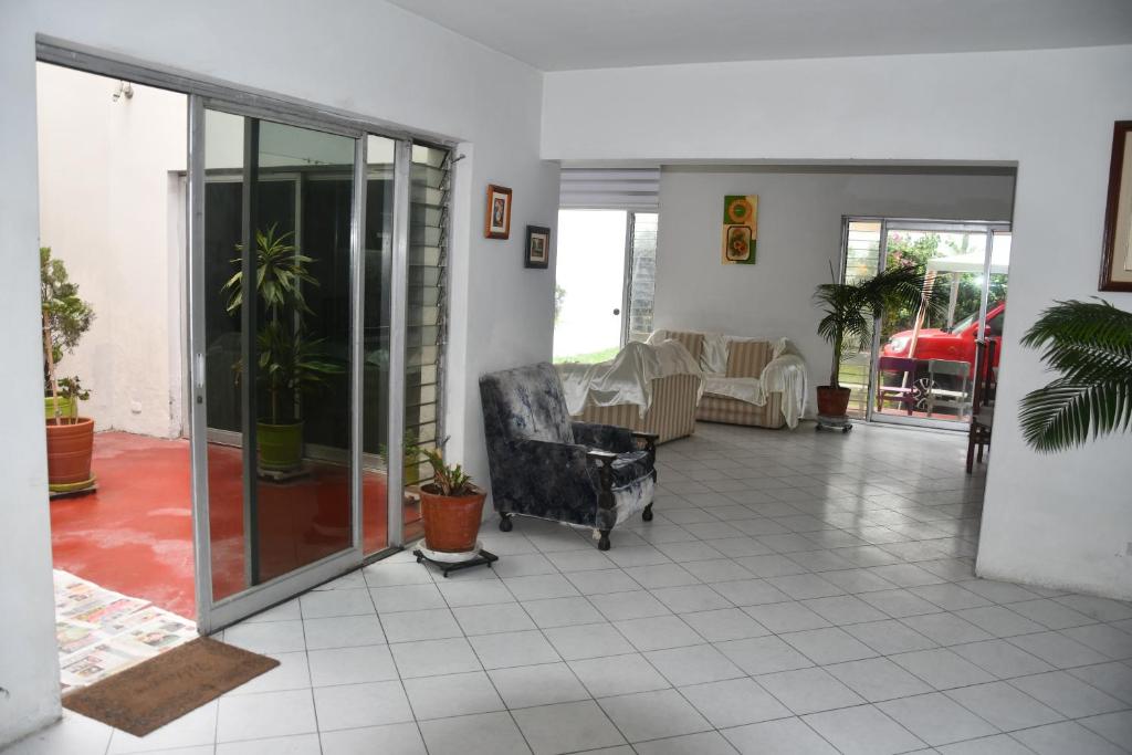 a living room with a couch and a chair at B&B Villamar Chorrillos in San Antonio