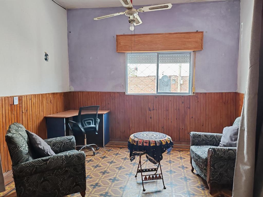 a living room with two couches and a table at Casa Marco in Fray Bentos