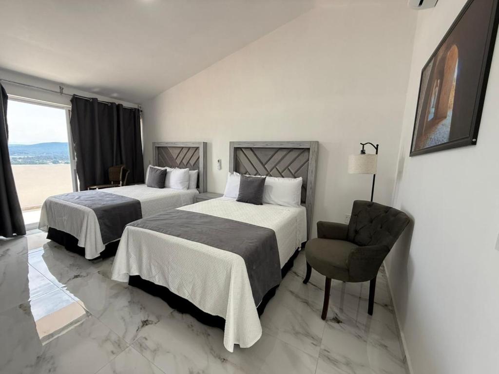 Postel nebo postele na pokoji v ubytování GS Villas Boutique