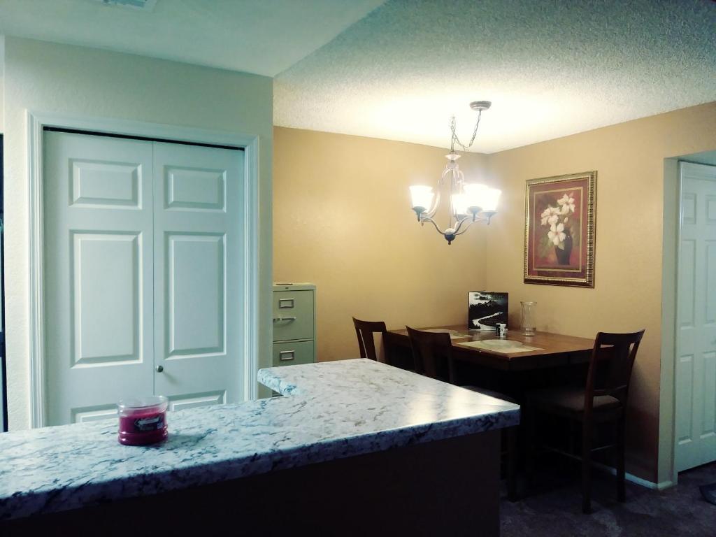 a kitchen with a table and a dining room at Arizona cozy place in Mesa