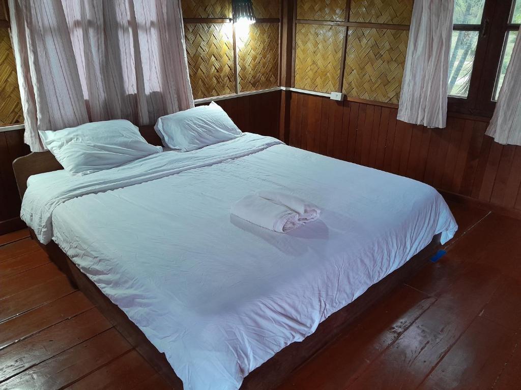 Ένα ή περισσότερα κρεβάτια σε δωμάτιο στο Sainamhai Resort