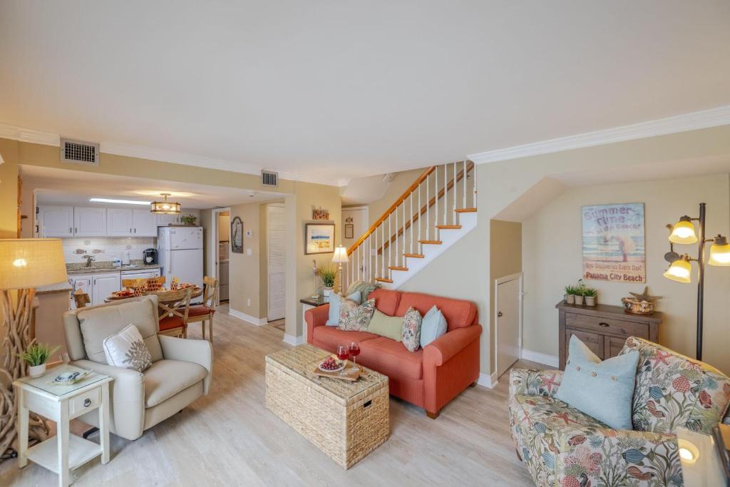 a living room filled with furniture and a kitchen at A Wave From It All at Pinnacle Port in Carillon Beach