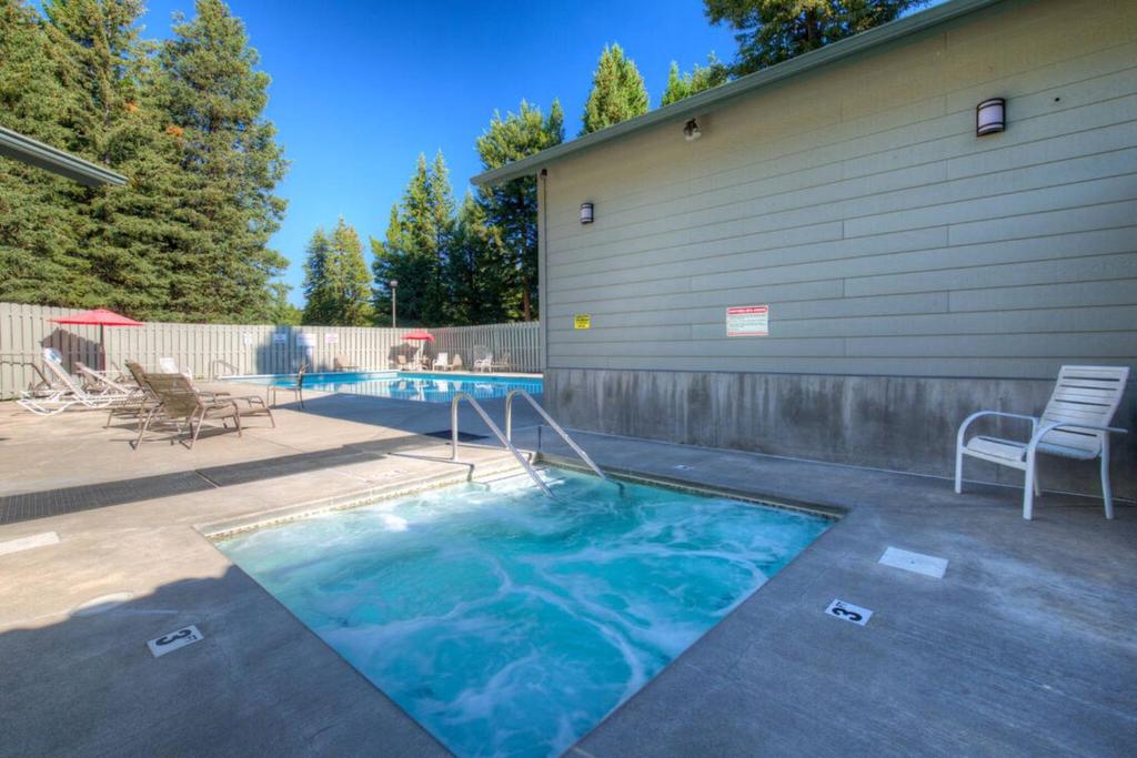 a small swimming pool with a chair next to a building at 382 Sunburst in Big Sky