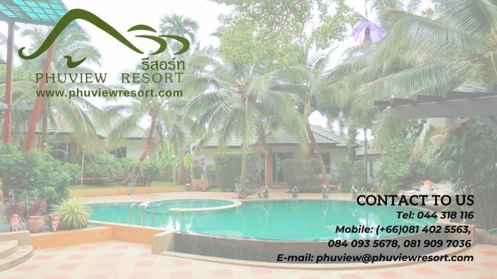 a picture of a swimming pool in front of a house at Phu View Resort Khao Yai in Mu Si