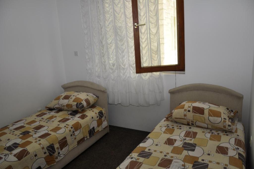 Postel nebo postele na pokoji v ubytování Guest House Lalic