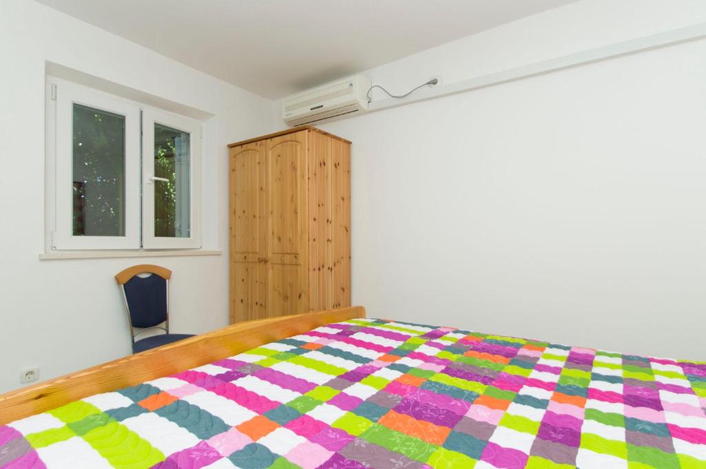 Postel nebo postele na pokoji v ubytování Apartment and rooms Jurišić