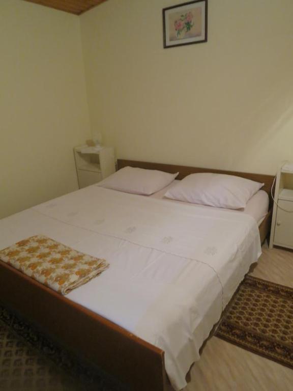 Łóżko lub łóżka w pokoju w obiekcie Apartments Rukavina