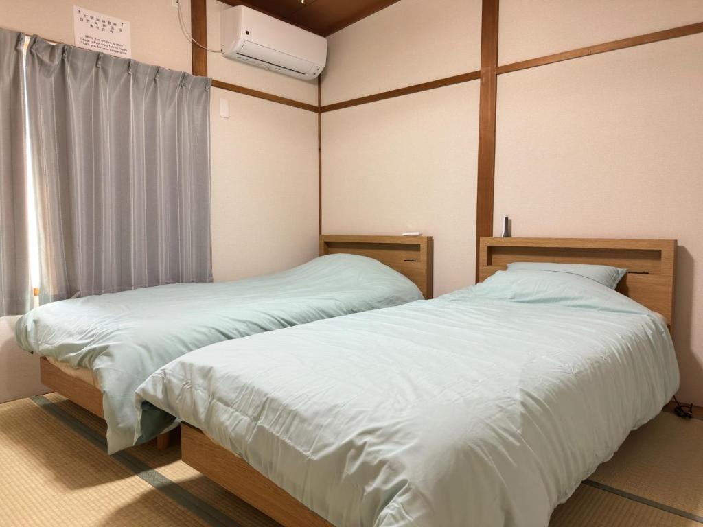 Postel nebo postele na pokoji v ubytování Nijo Yukyu "Y,K" - Vacation STAY 20016