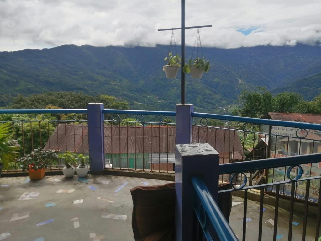 a balcony with a view of a mountain at Sittong Valley Homestay in Mangpu