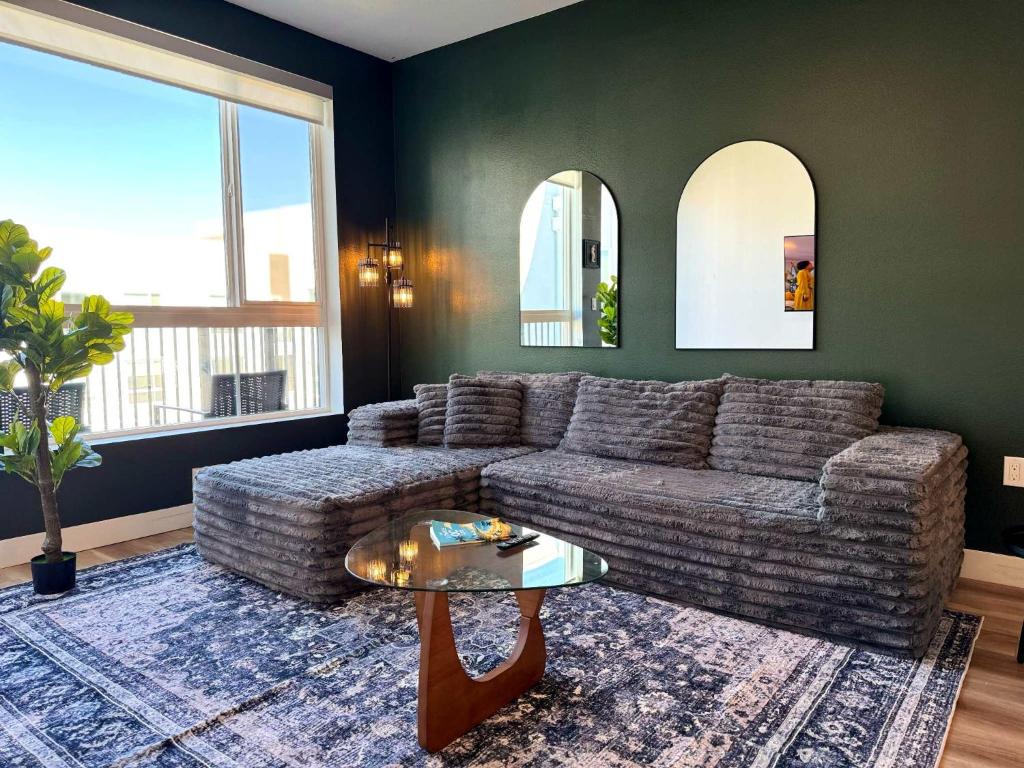 a living room with a couch and a table at Elegant Escape 10 Min from Disneyland With Pool & GYM in Tustin