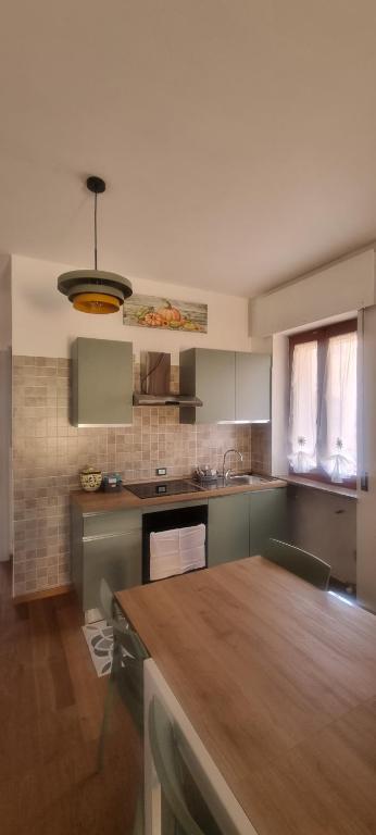 a kitchen with a wooden counter top in a room at L'Ulivo in Povegliano Veronese