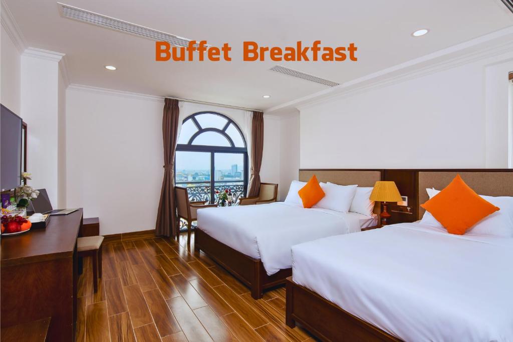 Postel nebo postele na pokoji v ubytování Roliva Hotel & Apartment Danang