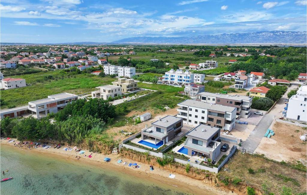 an aerial view of a beach with buildings at Gorgeous Apartment In Privlaka With House Sea View in Glavan