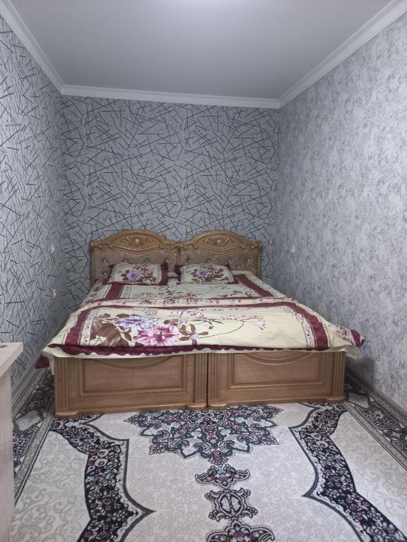 Ένα ή περισσότερα κρεβάτια σε δωμάτιο στο Uzbek House - Andijan 3