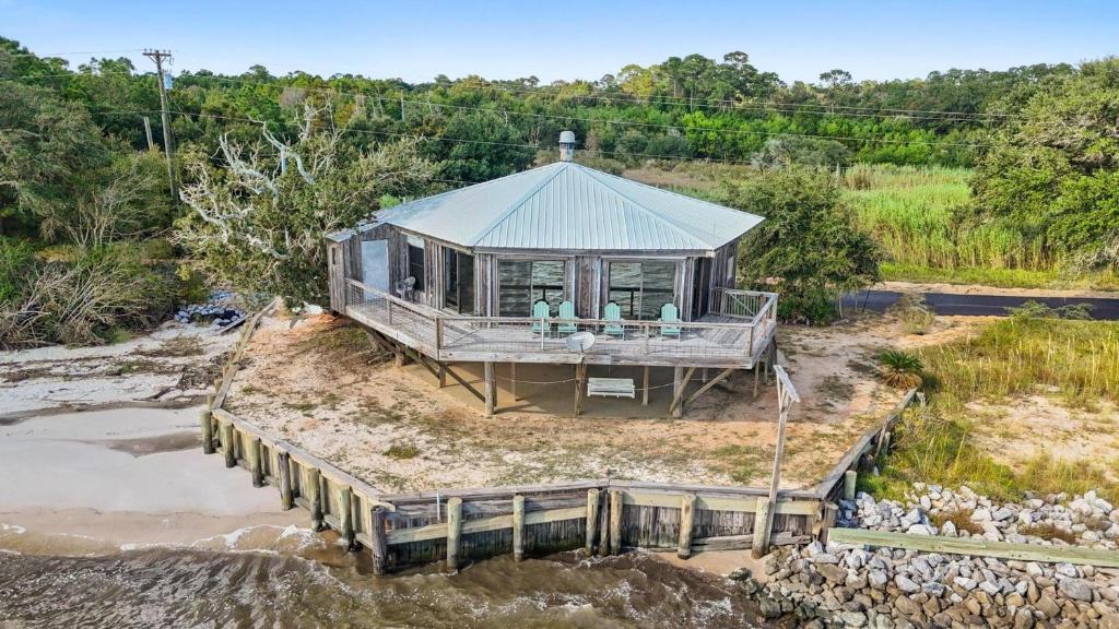 an aerial view of a house on a pier at Rustic Retreat in Ocean Springs