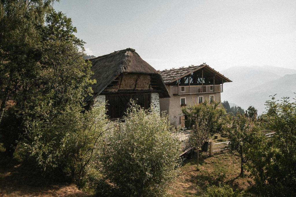 an old house in the middle of a mountain at South Tyrol Lodge With Mountain Views in Villandro