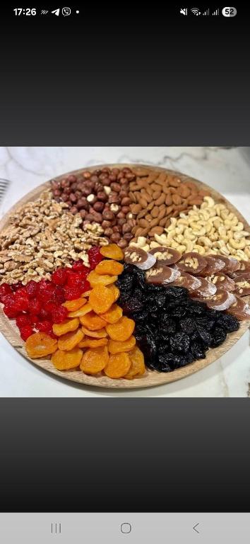 a plate of different types of nuts and dried fruits at television 