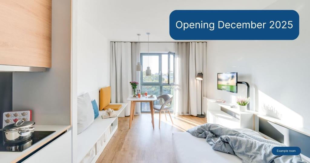 an apartment with a dining room and a living room at smartments Bielefeld Hauptbahnhof in Bielefeld