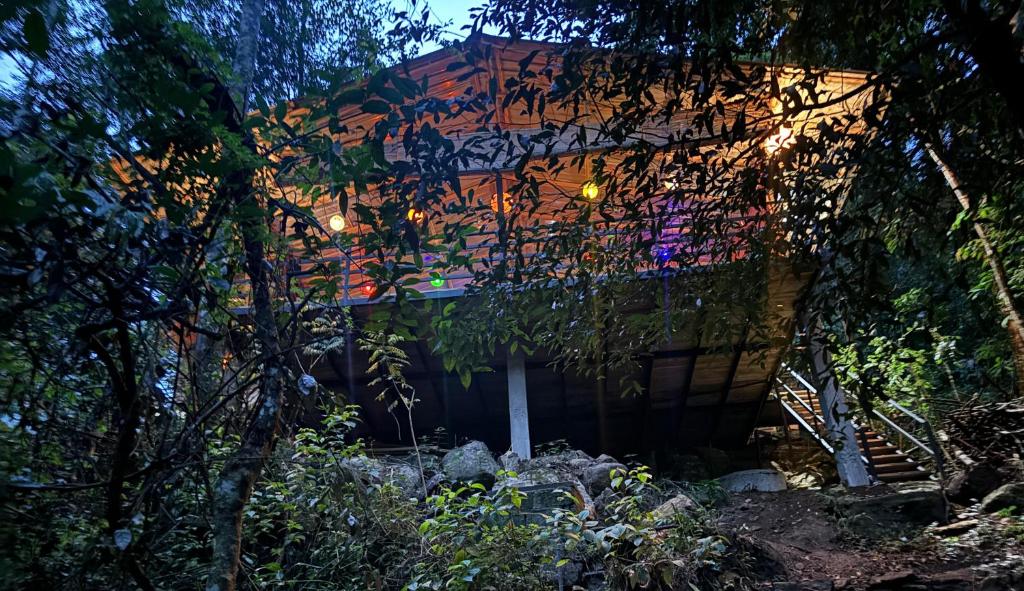 a building with lights on the side of it at Riverston Water Front Villa in Rattota