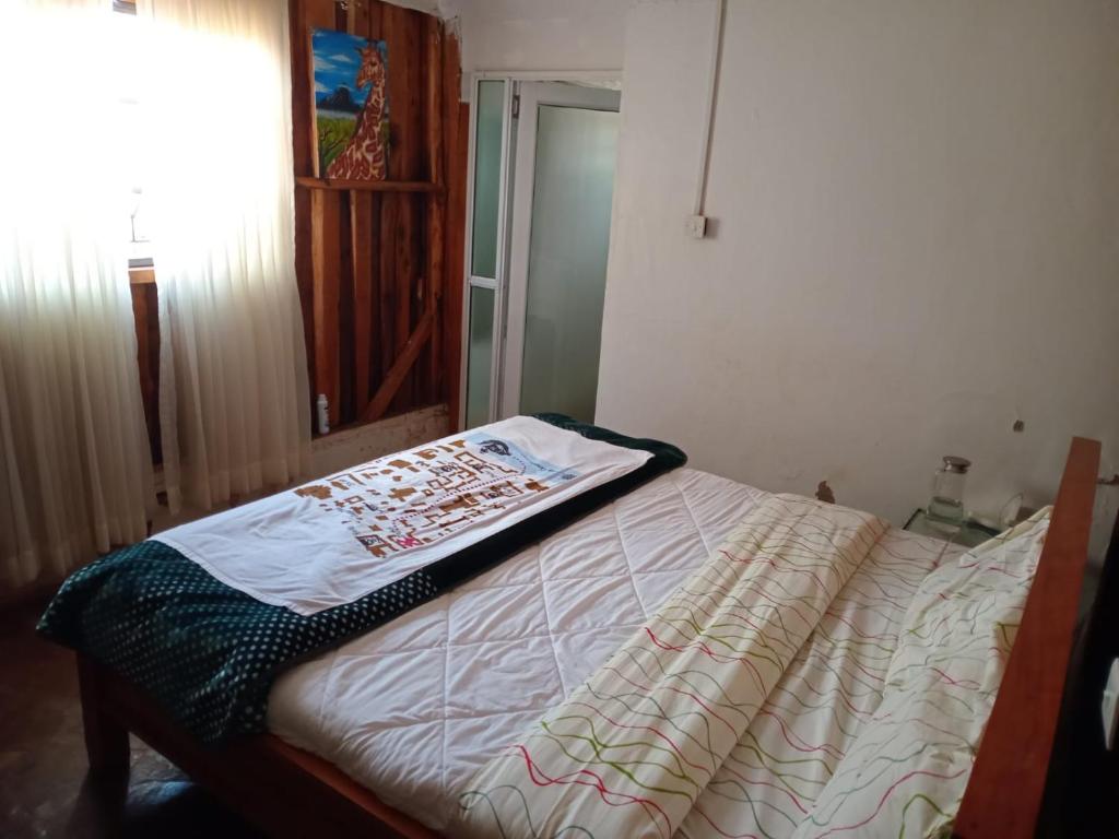 Katil atau katil-katil dalam bilik di Oldonyo Musa Camp Amboseli