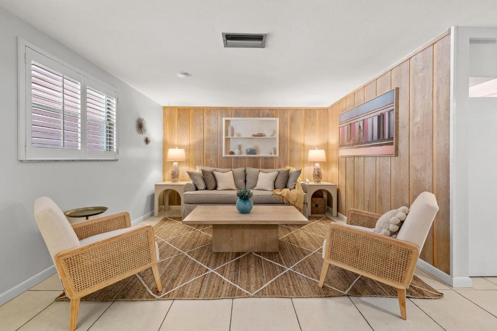 a living room with a couch and a table and chairs at Summer Nights in Bailey Hall
