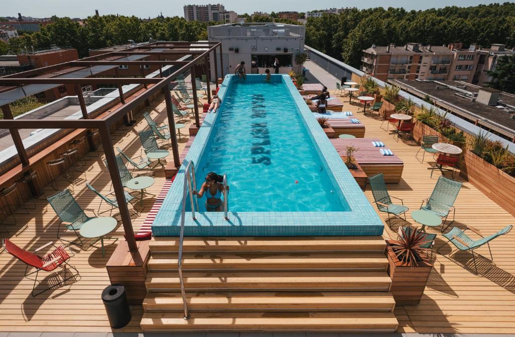 a swimming pool on the roof of a building at The Social Hub Toulouse in Toulouse