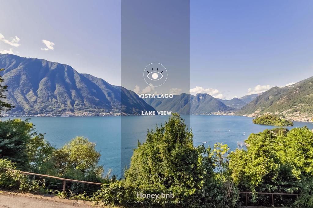 a view of a lake with mountains in the background at Molo BellaVista - Vista Lago - Parcheggio Privato in Lenno