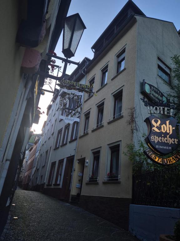 a building with a sign on the side of a street at Ferienhaus Sofia in Cochem