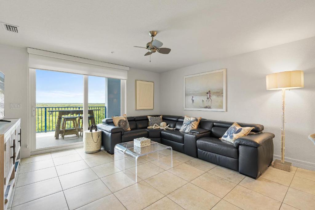 a living room with a couch and a table at Oceanwalk 17-502 in Chicken Island
