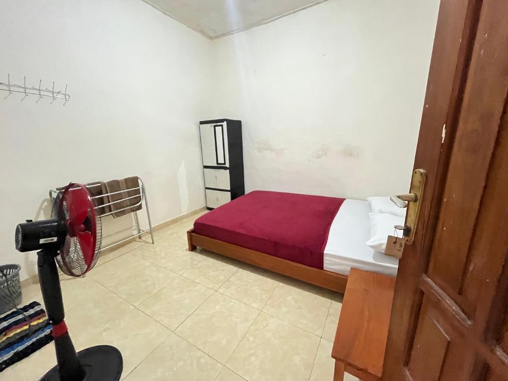 Ένα ή περισσότερα κρεβάτια σε δωμάτιο στο 55 Ketapang Homestay