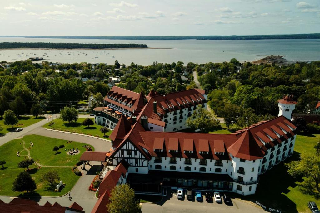 an aerial view of a building with a lake at The Algonquin Resort St. Andrews by-the-Sea, Autograph Collection in Saint Andrews