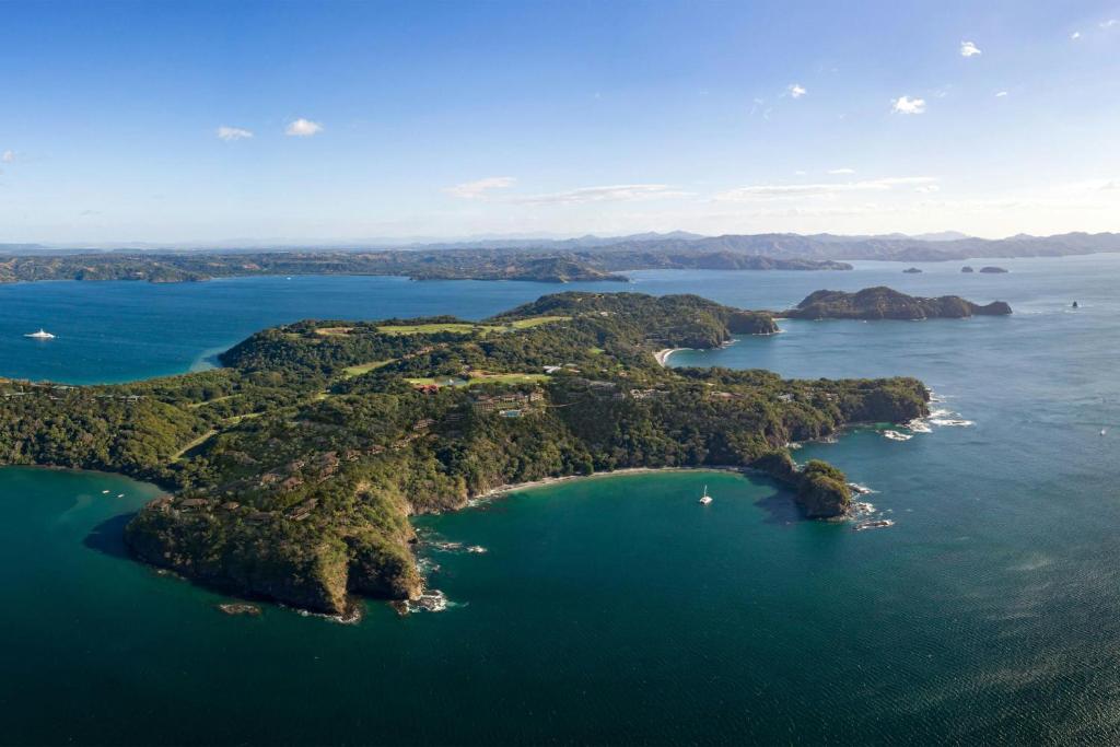an aerial view of an island in the water at Nekajui Peninsula Papagayo, a Ritz-Carlton Reserve Residence in Papagayo, Guanacaste