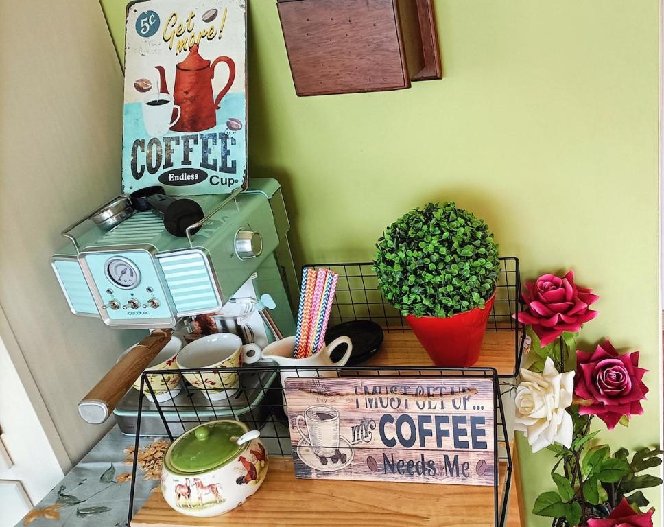 a shelf with a coffee machine and a sign at Rural Chalet in Arredondo in Arredondo