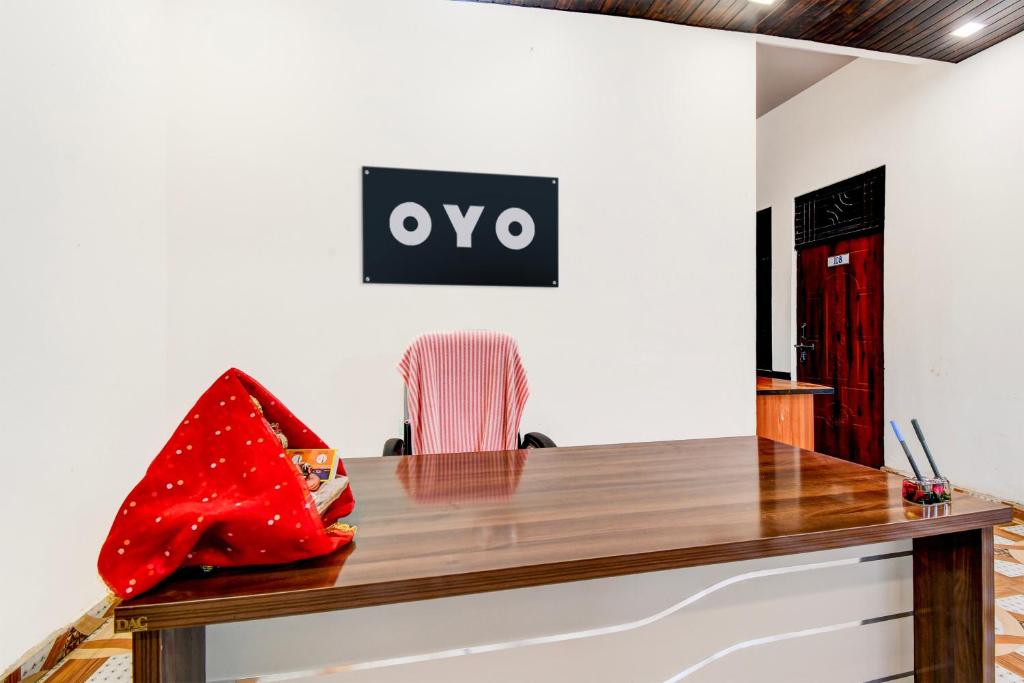 an office with a desk with a red bag on it at SPOT ON Hotel Shyam & Restaurant in Prayagraj