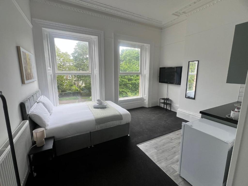 Ένα ή περισσότερα κρεβάτια σε δωμάτιο στο AA Sunderland Apartments