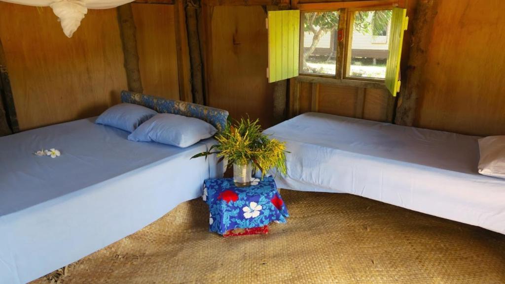 Letto o letti in una camera di Yasawa Homestays