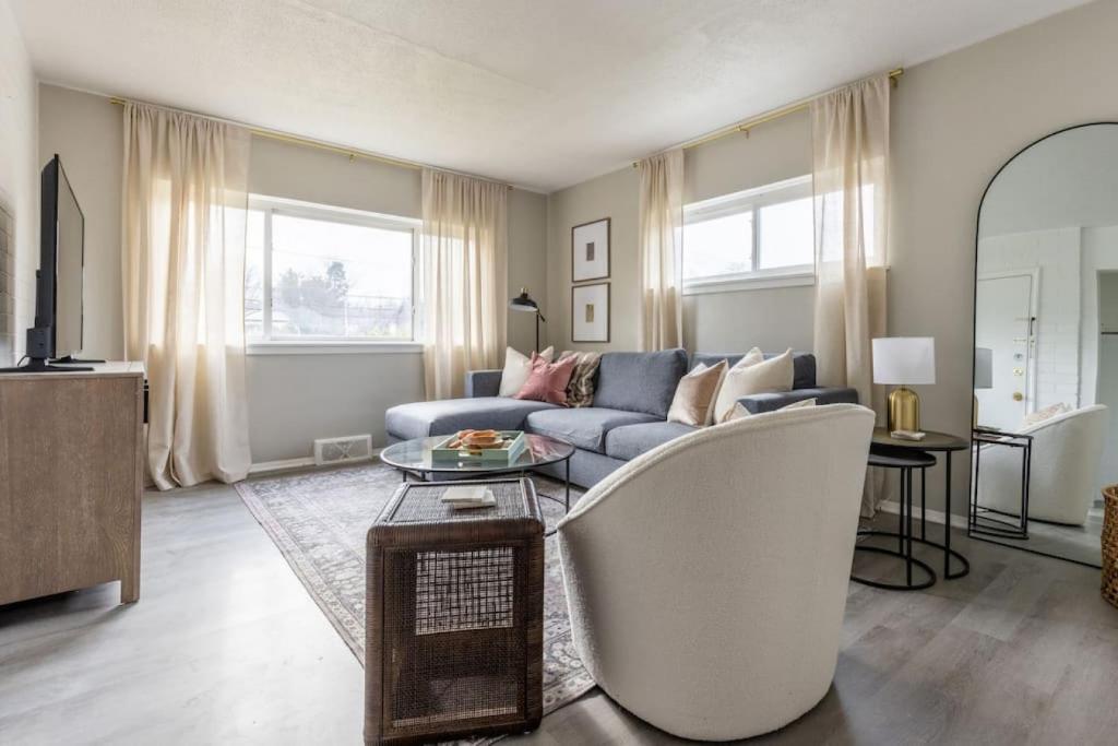 a living room with a couch and a table at Westlake Getaway Apartment in Westlake