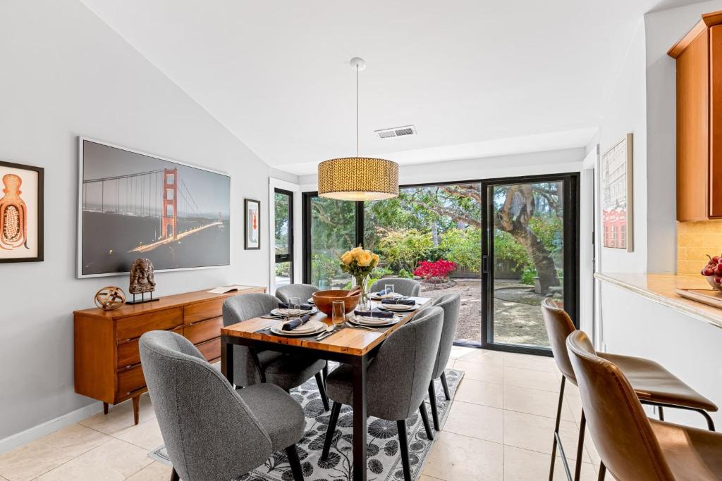 a dining room with a table and chairs at 3984 Life of Riley home in Del Monte Forest