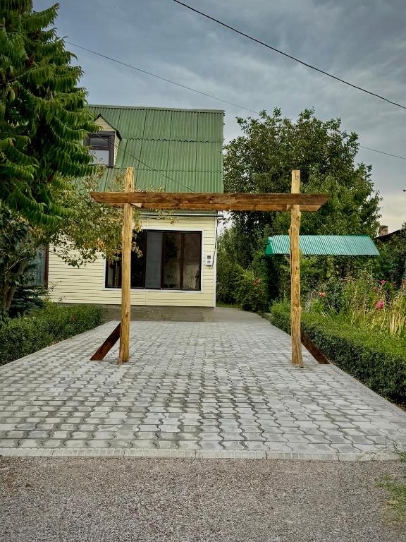 a wooden pavilion in front of a house at Nomad House in Yur'yevka