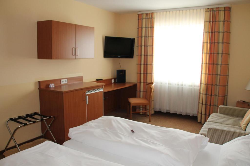 Postel nebo postele na pokoji v ubytování Park Residence