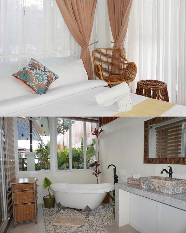 a bathroom with a bath tub and a sink at Villa Valber in Aga