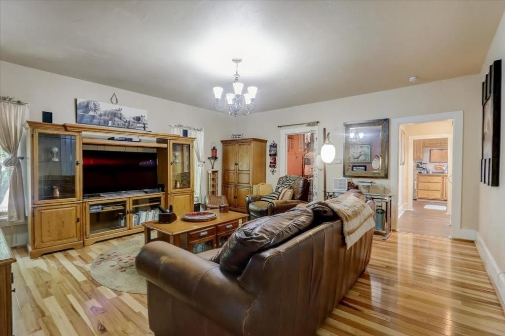 a living room with a couch and a television at Relax & Reboot 