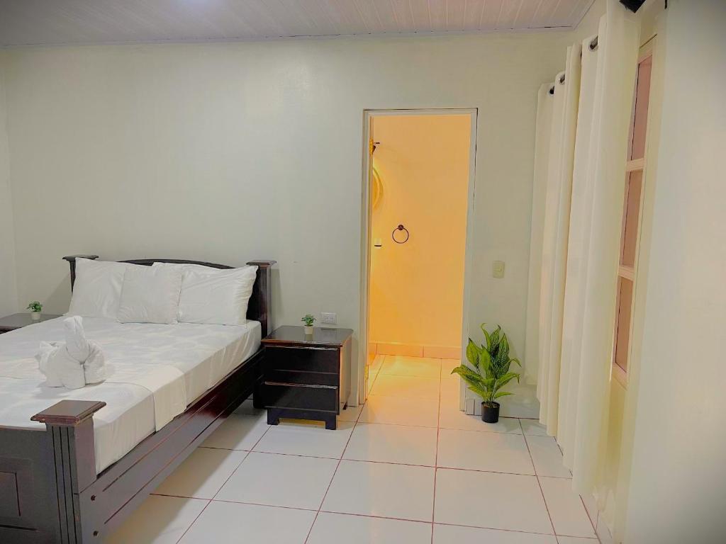 Ένα ή περισσότερα κρεβάτια σε δωμάτιο στο Paradise Island Hostal