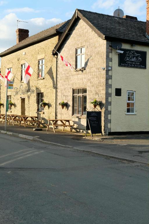 a building on the side of a street at The Castle Inn in Wigmore