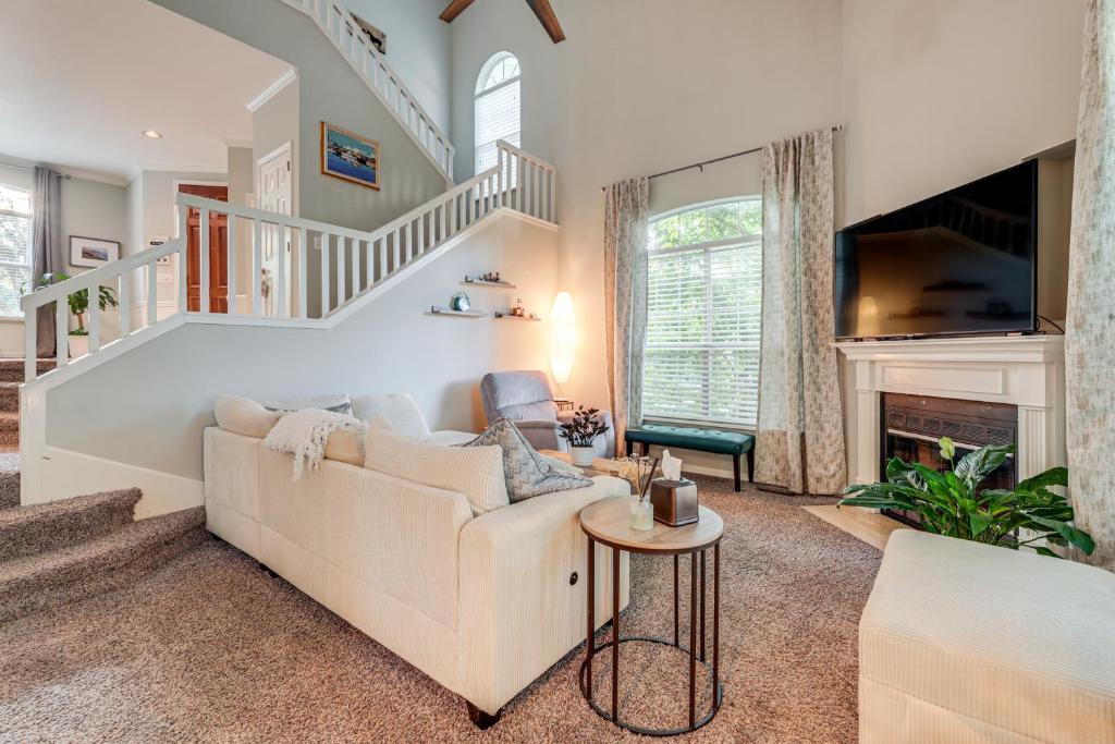 a living room with a couch and a fireplace at Family Home with Deck 12 Mi to Downtown Nashville! in Nashville
