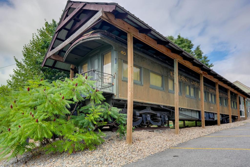 a train car on display in a parking lot at The Presidential Stay, Converted Railcar in DuBois in Adrian Furnace