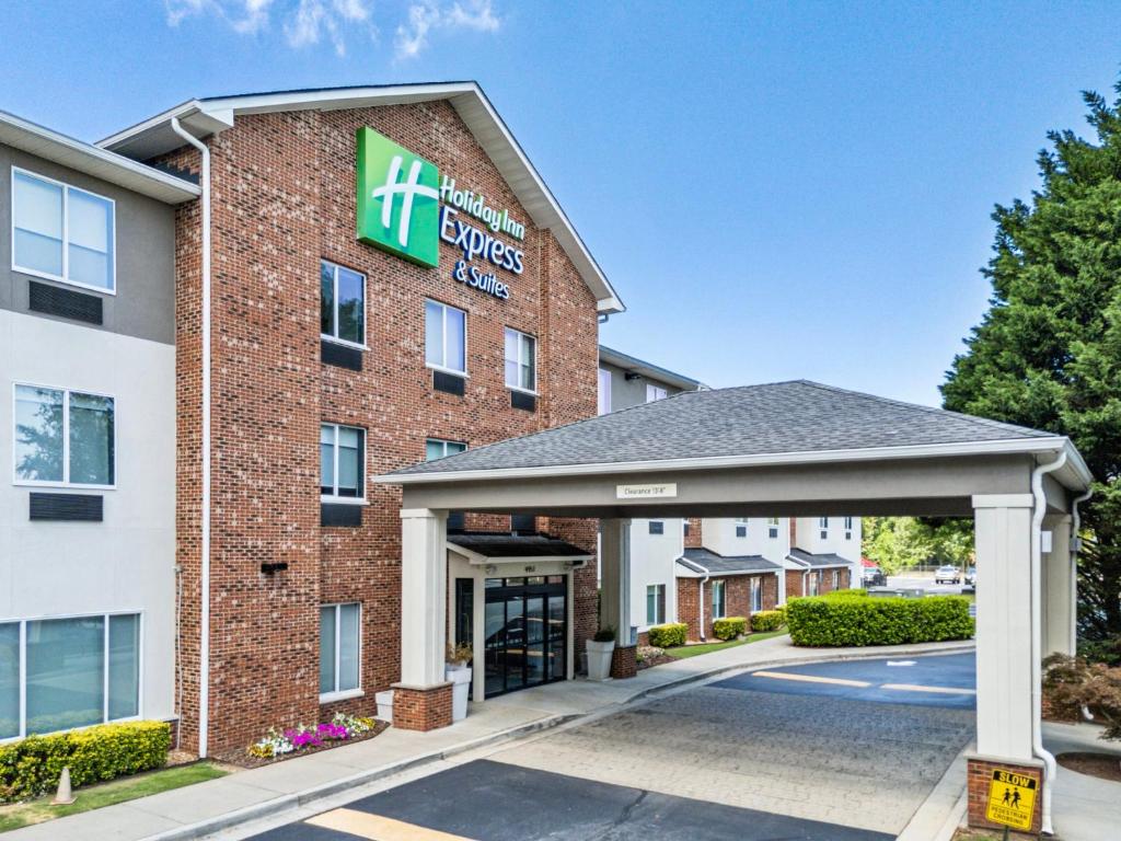a hotel with the entrance to a hotel at Holiday Inn Express & Suites Buford NE - Lake Lanier by IHG in Buford
